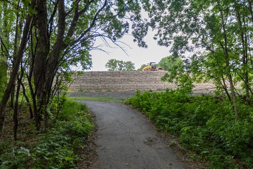 SASHA SEFTER / WINNIPEG FREE PRESS
 A new retaining wall which developers have installed in order to massively expand a trailer park stands about 10 feet high near Rivergrove Park..
190613 - Thursday, June 13, 2019.