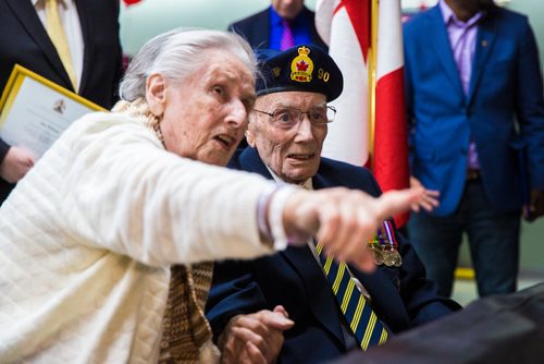 MIKAELA MACKENZIE / WINNIPEG FREE PRESS
Former corporal Ian Wilson and his wife Betty Wilson look at a display of photos before Ian receives the Legion of Honour at Deer Lodge Centre in Winnipeg on Saturday, June 15, 2019. For Caitlin Gowriluk story.
Winnipeg Free Press 2019.