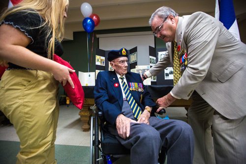 MIKAELA MACKENZIE / WINNIPEG FREE PRESS
Former corporal Ian Wilson receives the Legion of Honour from honourary French consulate Bruno Burnichon as great-granddaughter Kylee Rochon (left) watches at Deer Lodge Centre in Winnipeg on Saturday, June 15, 2019. For Caitlin Gowriluk story.
Winnipeg Free Press 2019.