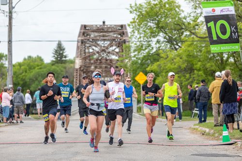 SASHA SEFTER / WINNIPEG FREE PRESS
Runners in the half marathon cross the Elm Park Bridge during the Manitoba Marathon.
190616 - Sunday, June 16, 2019.