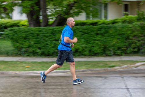 SASHA SEFTER / WINNIPEG FREE PRESS
Runners in the full marathon run down Oakenwald Avenue during the Manitoba Marathon.
190616 - Sunday, June 16, 2019.