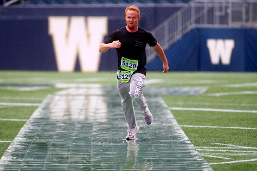 TREVOR HAGAN / WINNIPEG FREE PRESS
At the finish line of the Manitoba Marathon inside IG Field, Sunday, June 16, 2019.