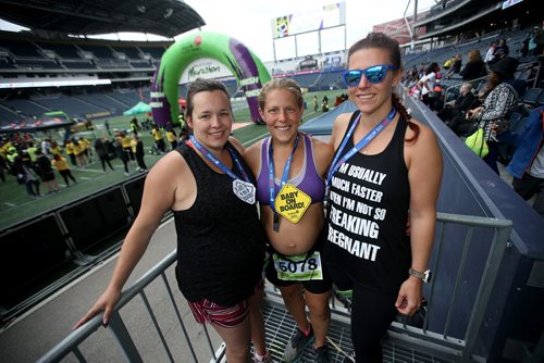 TREVOR HAGAN / WINNIPEG FREE PRESS
Ashly Reyes, Reesa Simmonds, and Breanne Peters, part of an all-pregnant relay team. At the finish line of the Manitoba Marathon inside IG Field, Sunday, June 16, 2019.