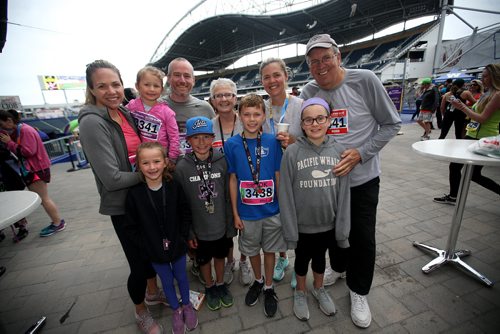 TREVOR HAGAN / WINNIPEG FREE PRESS
Group of 10 runners part of one family. Wedlake, Rempel and Hurton. For story. At the finish line of the Manitoba Marathon inside IG Field, Sunday, June 16, 2019.