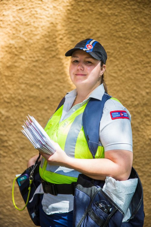 MIKAELA MACKENZIE / WINNIPEG FREE PRESS
Basia Sokal, former leader of the Winnipeg Labour Council who's since gone back to her job as a postal worker, on her route in West Broadway in Winnipeg on Monday, June 17, 2019. For Jessica Botelho-Urbanski story.
Winnipeg Free Press 2019.