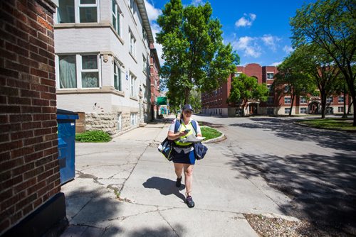 MIKAELA MACKENZIE / WINNIPEG FREE PRESS
Basia Sokal, former leader of the Winnipeg Labour Council who's since gone back to her job as a postal worker, on her route in West Broadway in Winnipeg on Monday, June 17, 2019. For Jessica Botelho-Urbanski story.
Winnipeg Free Press 2019.