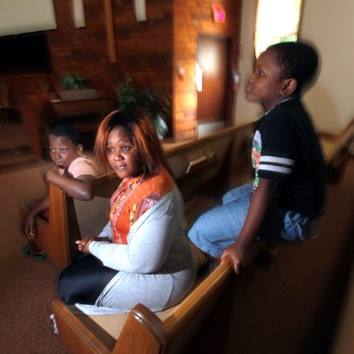 PHIL HOSSACK / WINNIPEG FREE PRESS - Fatmata Kargbo with her sons Thaduba (12yrs) left, and Mathebeh (6yrs) right in the Sanctuary of Chrestview Fellowship Church Monday. See Brenda Suderman's story.  - June 17, 2019.