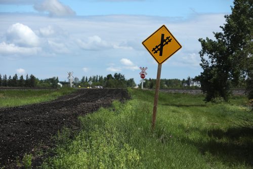 RUTH BONNEVILLE /  WINNIPEG FREE PRESS 

A 15-year-old boy is dead after a train and the dirt bike he was riding collided on Spruce Rd.  just one mile east of  Oakbank, Man. on Sunday evening.  

Photo taken from south side of tracks looking north.  

See Tessa Vanderhart story. 

June 17th, 2019
