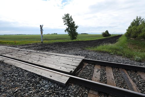 RUTH BONNEVILLE /  WINNIPEG FREE PRESS 

A 15-year-old boy is dead after a train and the dirt bike he was riding collided on Spruce Rd.  just one mile east of  Oakbank, Man. on Sunday evening.  

Photo taken from north side of tracks looking south east.  
 
See Tessa Vanderhart story. 

June 17th, 2019
