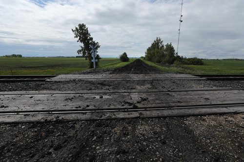 RUTH BONNEVILLE /  WINNIPEG FREE PRESS 

A 15-year-old boy is dead after a train and the dirt bike he was riding collided on Spruce Rd.  just one mile east of  Oakbank, Man. on Sunday evening.  

Photo taken from north side of tracks looking south.
 
See Tessa Vanderhart story. 

June 17th, 2019

