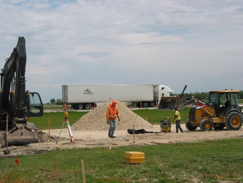 Canstar Community News June 11, 2019 - The service road in Oak Bluff Industrial Park is being resurfaced and the right and left turning lanes are being lengthened at the McGillivray Boulevard and Highway 3 intersection. (ANDREA GEARY/CANSTAR COMMUNITY NEWS)