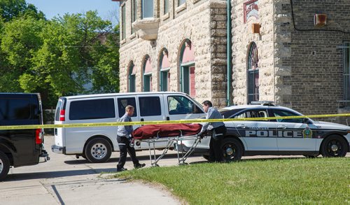 MIKE DEAL / WINNIPEG FREE PRESS
A body is taken away after the Winnipeg Police were called to the scene of what they are calling a suspicious death near the William Whyte Park Wednesday morning.
190619 - Wednesday, June 19, 2019.