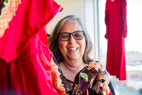 MIKAELA MACKENZIE / WINNIPEG FREE PRESS
Darlene Douglas, New Directions director of culture, education and training, with two of the 350 red dresses that theyre hanging Thursday in every window of their building at 717 Portage in Winnipeg on Wednesday, June 19, 2019. For Carol Sanders story.
Winnipeg Free Press 2019.