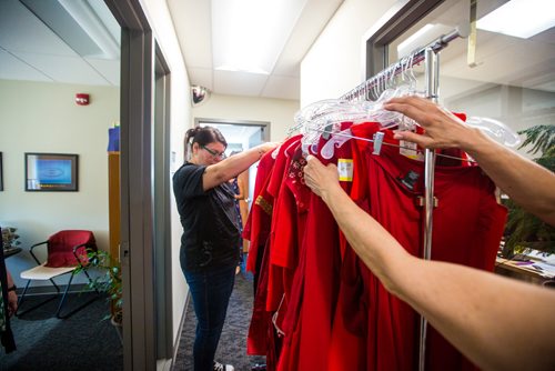 MIKAELA MACKENZIE / WINNIPEG FREE PRESS
Sharon Olsen, support facilitator for the RAP program, sorts and hands out some of the 350 red dresses that theyre hanging Thursday in every window of their building at 717 Portage with the help of Karen Hill, coordinator with Opikihiwawin (right), in Winnipeg on Wednesday, June 19, 2019. For Carol Sanders story.
Winnipeg Free Press 2019.