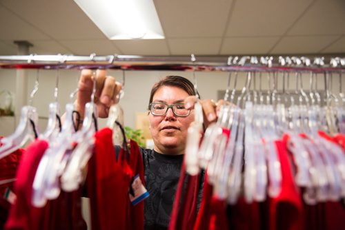 MIKAELA MACKENZIE / WINNIPEG FREE PRESS
Sharon Olsen, support facilitator for the RAP program, sorts and hands out some of the 350 red dresses that theyre hanging Thursday in every window of their building at 717 Portage in Winnipeg on Wednesday, June 19, 2019. For Carol Sanders story.
Winnipeg Free Press 2019.