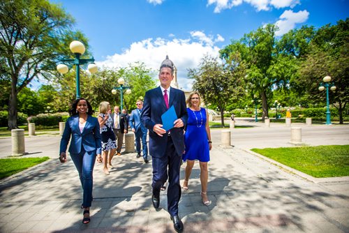 MIKAELA MACKENZIE / WINNIPEG FREE PRESS
Premier Brian Pallister walks up to a press conference announcing a September election date in front of the Manitoba Legislative Building with Southdale candidate Audrey Gordon, left, and Minister of Sustainable Development Rochelle Squires in Winnipeg on Wednesday, June 19, 2019. For Larry/Dan story.
Winnipeg Free Press 2019.