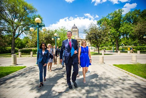 MIKAELA MACKENZIE / WINNIPEG FREE PRESS
Premier Brian Pallister walks up to a press conference announcing a September election date in front of the Manitoba Legislative Building with Southdale candidate Audrey Gordon, left, and Minister of Sustainable Development Rochelle Squires in Winnipeg on Wednesday, June 19, 2019. For Larry/Dan story.
Winnipeg Free Press 2019.