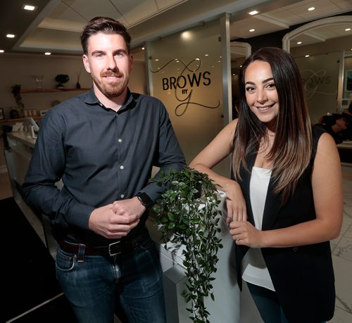 PHIL HOSSACK / WINNIPEG FREE PRESS -  Scott Russell and Giovanna Minenna
pose together at Giovanna's shop 'Brows By G'.
They're a young couple who are both engaged in running their own businesses and helping each other in the process. Scott worked with Giovanna as they started up Brows by G (and pitched it together on a recent episode of Dragons Den) and now he is working on an energy-related tech startup. See Martin Cash story. - June 19, 2019.