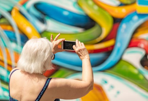 SASHA SEFTER / WINNIPEG FREE PRESS
Mural lovers snap photos during a luncheon put on by The Murals of Winnipeg website to honour its selection for the 2018 Mural of the Year a 46' x 12.5' mural titled "Life Goddess" by aerosol artist Mike Johnston adorns Sevala's Ukrainian Deli in Transcona. 
190620 - Thursday, June 20, 2019.