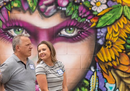 SASHA SEFTER / WINNIPEG FREE PRESS
(Left) Son of Sevala's Deli owner Del Demchuk and his daughter Sam Demchuk stand in front of artist Mike Johnston's 2018 Mural of the Year a 46' x 12.5' mural titled "Life Goddess" painted on the side of Sevala's Ukrainian Deli in Transcona during a luncheon put on by The Murals of Winnipeg website.
190620 - Thursday, June 20, 2019.