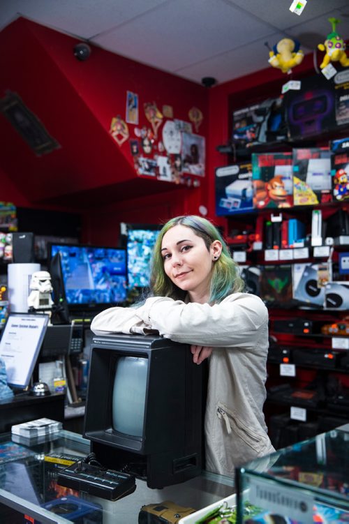 MIKAELA MACKENZIE / WINNIPEG FREE PRESS
Cobra Collectibles manager Kailyn Gregorash poses for a photo with a Vectrex in front of vintage video game consoles in the store in Winnipeg on Thursday, June 20, 2019. For Declan story.
Winnipeg Free Press 2019.