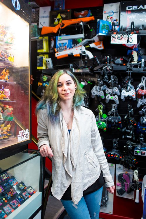 MIKAELA MACKENZIE / WINNIPEG FREE PRESS
Cobra Collectibles manager Kailyn Gregorash poses for a photo among vintage video game paraphernalia in the store in Winnipeg on Thursday, June 20, 2019. For Declan story.
Winnipeg Free Press 2019.