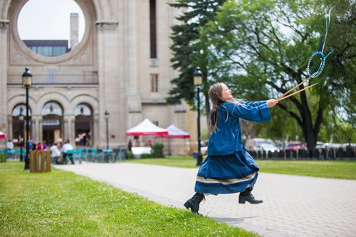 MIKAELA MACKENZIE / WINNIPEG FREE PRESS
Océane Woods (with Manitoba Living History), eight, plays a game called graces at the Grey Nuns' 175th anniversary celebration at the Saint Boniface Cathedral in Winnipeg on Friday, June 21, 2019. For Caitlyn story.
Winnipeg Free Press 2019.