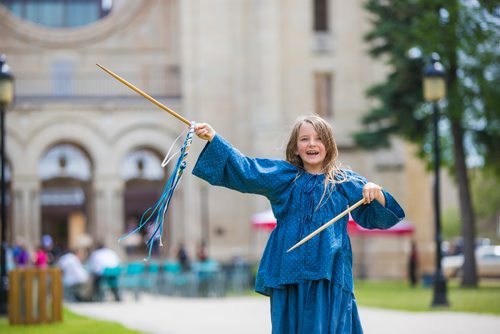 MIKAELA MACKENZIE / WINNIPEG FREE PRESS
Océane Woods (with Manitoba Living History), eight, plays a game called graces at the Grey Nuns' 175th anniversary celebration at the Saint Boniface Cathedral in Winnipeg on Friday, June 21, 2019. For Caitlyn story.
Winnipeg Free Press 2019.