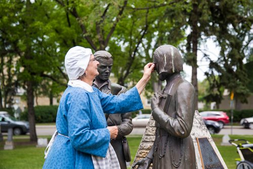 MIKAELA MACKENZIE / WINNIPEG FREE PRESS
Susan Styrchak brushes off Jean Baptiste's nose at the Grey Nuns' 175th anniversary celebration at the Saint Boniface Cathedral in Winnipeg on Friday, June 21, 2019. For Caitlyn story.
Winnipeg Free Press 2019.