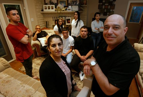 PHIL HOSSACK / WINNIPEG FREE PRESS -  Munther Zeid his wife Samar (front) pose with their seven children, L-R Tarik, Wajih, Japan, Mohammad, Nadine, Bilal and Sue. See Doug Speirs story? - June 21, 2019.