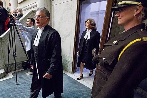 MIKE DEAL / WINNIPEG FREE PRESS

Justice Lori T. Spivak enters the courtroom for her swearing-in ceremony to the Manitoba Court of Appeal at the Law Courts Complex, 408 York Avenue, Friday afternoon. Ahead of her is Chief Justice Richard Chartier.

190621 - Friday, June 21, 2019.