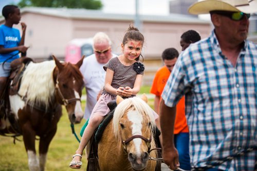 MIKAELA MACKENZIE / WINNIPEG FREE PRESS
Estervan Jakl, seven, gets a pony ride at Aboriginal Day festivities at the Freighthouse Community Centre in Winnipeg on Friday, June 21, 2019. 
Winnipeg Free Press 2019.