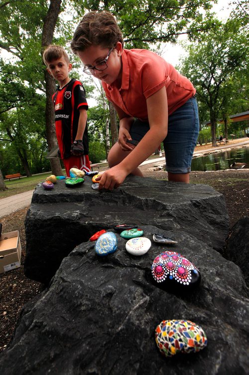 PHIL HOSSACK / WINNIPEG FREE PRESS -  Brynn Kroeker and her brother Grayson spread out a selection of painted rocks, some keepers other to be left along trails for visitors to find.  See Dave Sanderson story? - June 18, 2019.