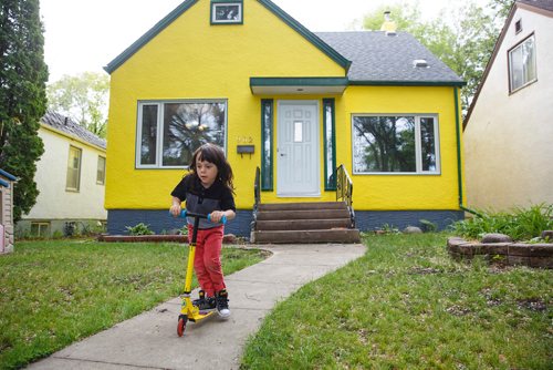 MIKE DEAL / WINNIPEG FREE PRESS
Marina Havard had first time home owner recently had her home painted and through a series of missteps it was accidentally painted such a bright shade of yellow that her neighbours complained about it to her.  
Marina Harvards son Quinn, 4, reacts to the bright shade of yellow.
190622 - Saturday, June 22, 2019.