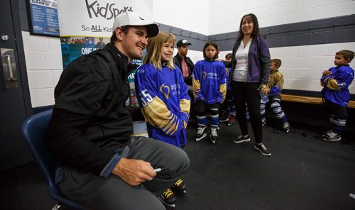MIKE DEAL / WINNIPEG FREE PRESS
Mark Scheifele signs Lily Benjaminson's, 7, jersey and poses for a photo during the 5th annual Mark Scheifele Hockey Camp for Team Kidsport at the Bell MTS Iceplex Saturday.
190622 - Saturday, June 22, 2019.