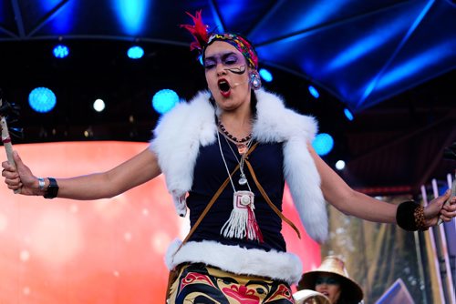 Daniel Crump / Winnipeg Free Press. The Dakhká Khwáan Dancers with DJ Dash perform during APTN Indigenous Day Live 2019 at the Forks, Winnipeg. June 19, 2019.