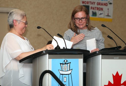 JASON HALSTEAD / WINNIPEG FREE PRESS

Sandra Ebata of the Grand Chapter of Manitoba, Order of the Eastern Star (left), presents a donation to Kristy McFee, executive director of Manitoba Riding for the Disabled, at the Order of the Eastern Star's annual convention May 27, 2019, at Canad Inns Polo Park. (See Social Page)