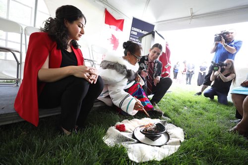 RUTH BONNEVILLE / WINNIPEG FREE PRESS   


 The Honourable Maryam Monsef, Minister for Women and Gender Equality and member of Parliament for Winnipeg South, Robert-Falcon Ouellette, sit next to Annie Bowkett a Inuit women originally from Nunavut, as she performs a traditional Inuit ritual with oil and fire called Qulliq at the start of press conference for a government announcement regarding the Commemoration Fund for Missing and Murdered Indigenous Women and Girls at the Forks Monday.   


More info on the Qullq: The Qulliq (Inuit Lamp) is incorporated into the Truth-Gathering Process. It symbolizes Inuit womens strength, care, and love. The Qulliq represent the light and warmth provided at the hearth. The lamp is made for a woman as a gift from her husband. Then, as the owner, she becomes the flame keeper.   


 June 24, 2019