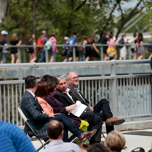 PHIL HOSSACK / WINNIPEG FREE PRESS -  Dignitaries seated on Tache for the dedication, watch pedestrians use the new St Boniface Belvedere (Wikapedia defines Belvedere as a ' Beautiful' Place') on Tache Monday morning. See story.  - June 24, 2019.