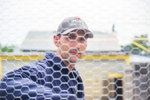 MIKAELA MACKENZIE / WINNIPEG FREE PRESS
Karl Schoenrock, co-owner of Kismet Creek Farm, poses in his quarantined chicken coop near Steinbach, Manitoba on Monday, June 24, 2019. Their rescue chickens have been infected with ILT (a highly contagious chicken virus) but they've been approved for a long-term quarantine so they don't have to kill them off. For Tessa Vanderhart story.
Winnipeg Free Press 2019.