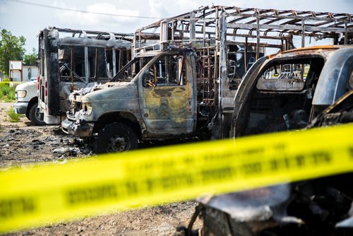 MIKAELA MACKENZIE / WINNIPEG FREE PRESS
Police tape surrounds burned-out cars and minibuses on Wall Street in Winnipeg on Tuesday, June 25, 2019. Standup.
Winnipeg Free Press 2019.