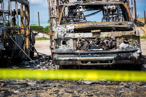 MIKAELA MACKENZIE / WINNIPEG FREE PRESS
Police tape surrounds burned-out cars and minibuses on Wall Street in Winnipeg on Tuesday, June 25, 2019. Standup.
Winnipeg Free Press 2019.