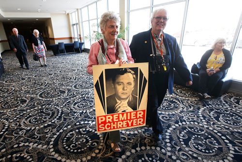 JOHN WOODS / WINNIPEG FREE PRESS
Gay and Dwight Stewart from Birtle, MB, carry an election poster of former NDP premier and governor-general Ed Schreyer as they enter a dinner today, Tuesday, June 25, 2019, which honoured Schreyer and the NDPs first election win in Manitoba 50 years ago today. 

Reporter:standup