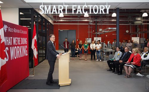 MIKE DEAL / WINNIPEG FREE PRESS
Red River College officially opened the doors to its brand-new Smart Factory Friday morning.
The facility is a state-of-the-art learning and applied research space that will directly support Manitoba's growing aerospace and manufacturing industries.
Paul Vogt, President and CEO of RRC speaks during the official opening ceremonies.
190628 - Friday, June 28, 2019.