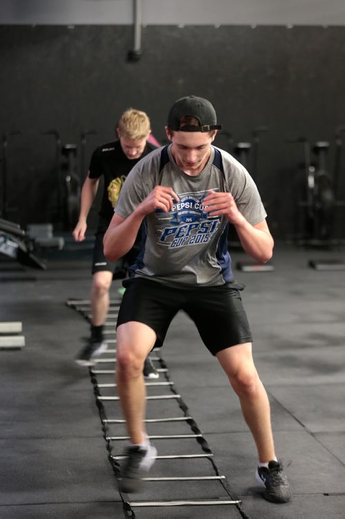 PHIL HOSSACK / WINNIPEG FREE PRESS - Cole Younger (grey shirt) and Easton Lewicki (black shirt) do their footwork at the Cross Fit 204 Gym Wednesday evening. The 15 yr old teenagers are part of a summer fitness program. See Sabrina Carnevale story.  - July 3, 2019.