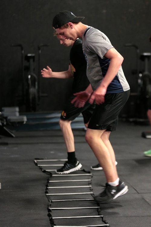PHIL HOSSACK / WINNIPEG FREE PRESS - Cole Younger (grey shirt) and Easton Lewicki (black shirt) do their footwork at the Cross Fit 204 Gym Wednesday evening. The 15 yr old teenagers are part of a summer fitness program. See Sabrina Carnevale story.  - July 3, 2019.