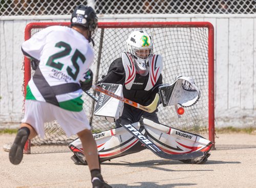 SASHA SEFTER / WINNIPEG FREE PRESS
Tyler Nault of the Smokin Aces fshoots and scores on the  NCN Steelers goal during the second annual Manitoba Indigenous Youth Ball Hockey Tournament held at the Norberry-Glenlee Community Centre.
190706 - Saturday, July 06, 2019.