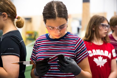 MIKAELA MACKENZIE / WINNIPEG FREE PRESS
Avery Delaney, 14, takes a look at her piece of copper for a lamp base at the Girls Exploring Trades and Technology at Red River College in Winnipeg on Tuesday, July 9, 2019. For Nadya Pankiw story.
Winnipeg Free Press 2019.