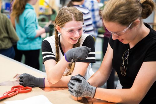 MIKAELA MACKENZIE / WINNIPEG FREE PRESS
Grace Alice Holt Frank (left) and Mackenzie Klein try out different ways of texturing their copper lamp bases at the Girls Exploring Trades and Technology at Red River College in Winnipeg on Tuesday, July 9, 2019. For Nadya Pankiw story.
Winnipeg Free Press 2019.