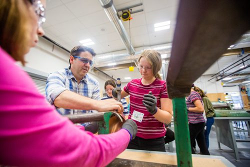 MIKAELA MACKENZIE / WINNIPEG FREE PRESS
Gabi Westendorf, 12, curves her piece of copper for a lamp base with the help of Sydney Matias (left) and sheet metal instructor Luis Matias at the Girls Exploring Trades and Technology at Red River College in Winnipeg on Tuesday, July 9, 2019. For Nadya Pankiw story.
Winnipeg Free Press 2019.